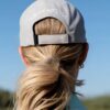 La Regalia LR Monogram Cap in grey and black with embroidered LR monogram, structured curved brim and adjustable strap, premium equestrian lifestyle cap