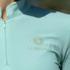 La Regalia Solana Baselayer with signature Argentinian half sun design on the back, cuffed sleeves and built-in sun protection, lightweight equestrian baselayer