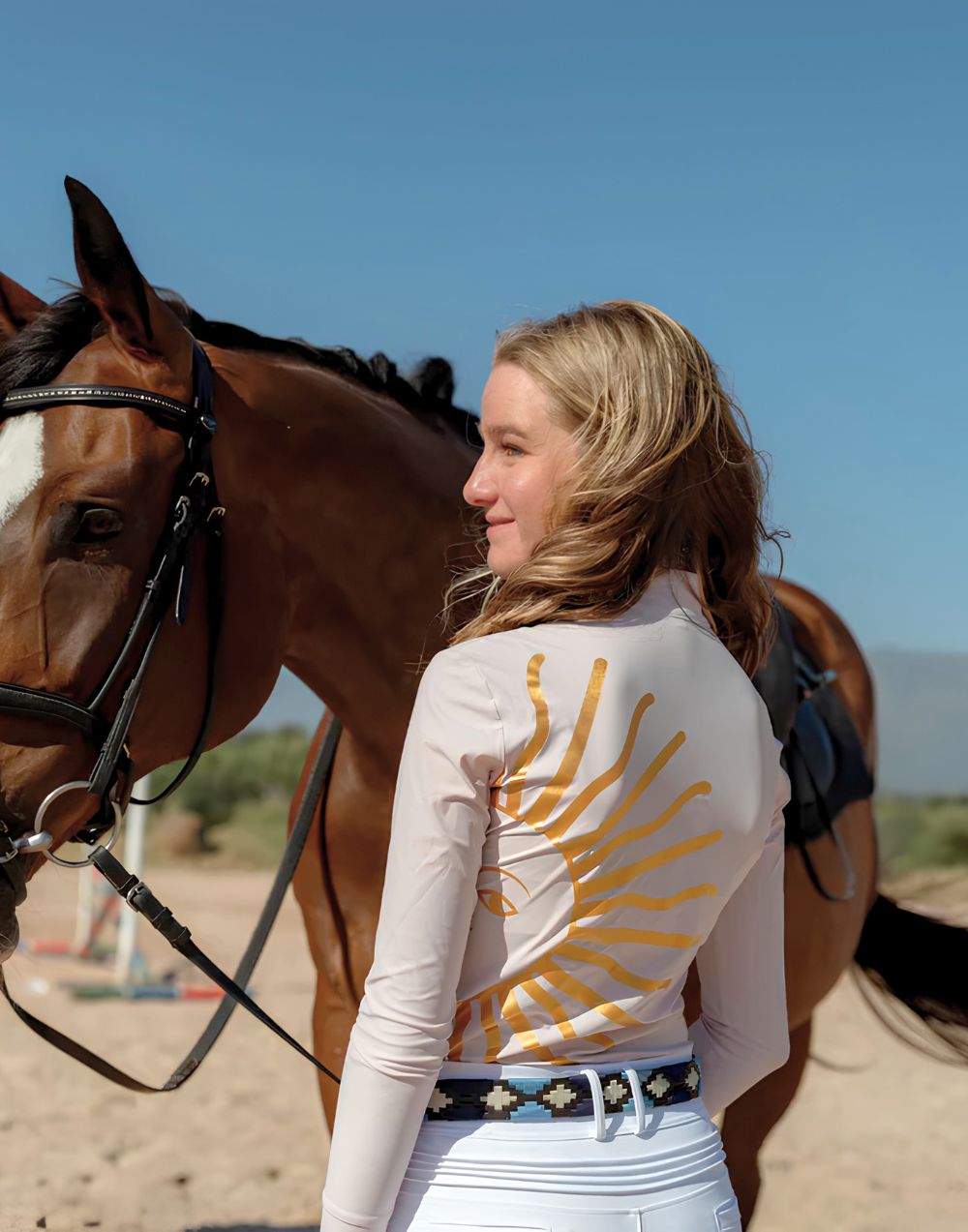 La Regalia Solana Baselayer with signature Argentinian half sun design on the back, cuffed sleeves and built-in sun protection, lightweight equestrian baselayer