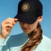 La Regalia Sun Cap with structured curved brim, signature Argentinian sun embroidery and adjustable strap, premium equestrian lifestyle cap