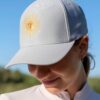 La Regalia Sun Cap with structured curved brim, signature Argentinian sun embroidery and adjustable strap, premium equestrian lifestyle cap