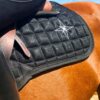 Diamond Dust Numnah in black with subtle shimmer finish, premium quilted construction and high wither cut, elegant equestrian saddle pad for training and competition